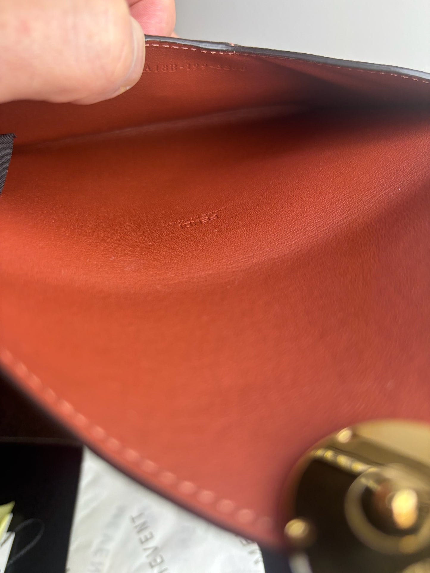 Fendi F Flat mini pouch clutch in orange pebbled leather