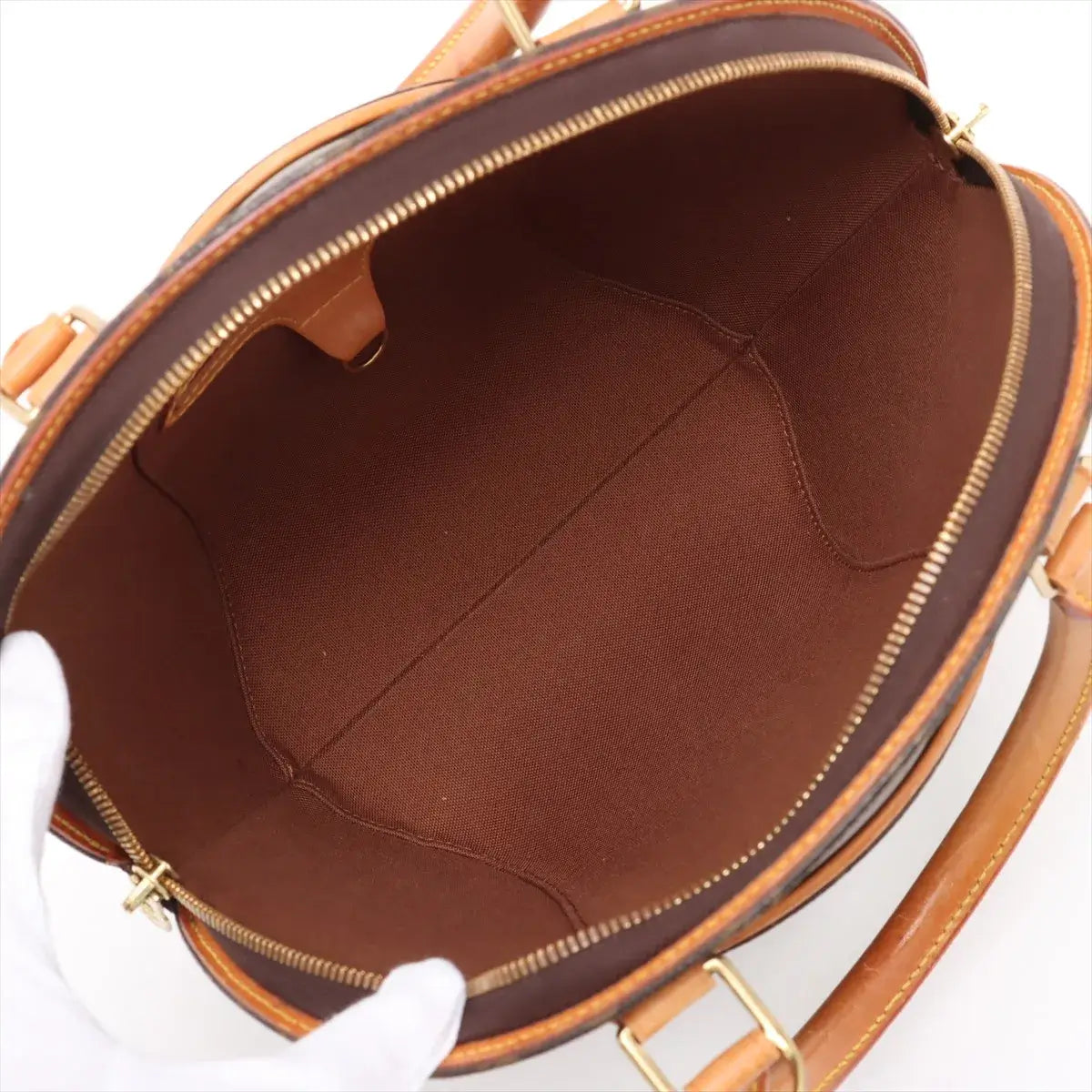 Interior view of the Louis Vuitton Monogram Ellipse PM Brown M51127 SD1929 (Pre-Owned), showcasing its spacious brown lining.