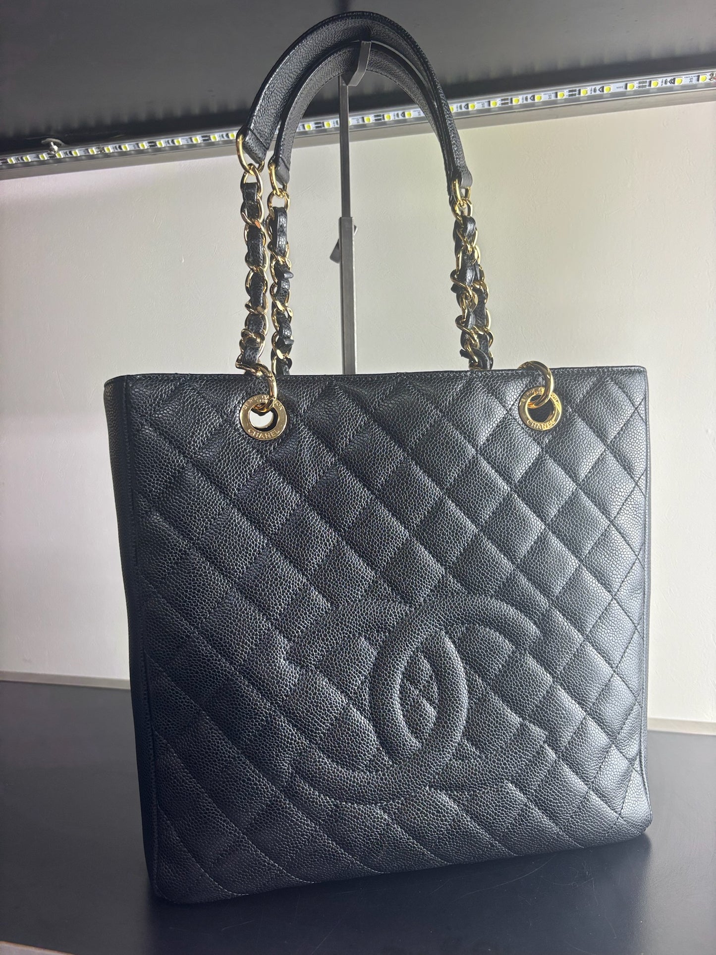 Chanel Petite Shopping Tote crafted in black caviar leather