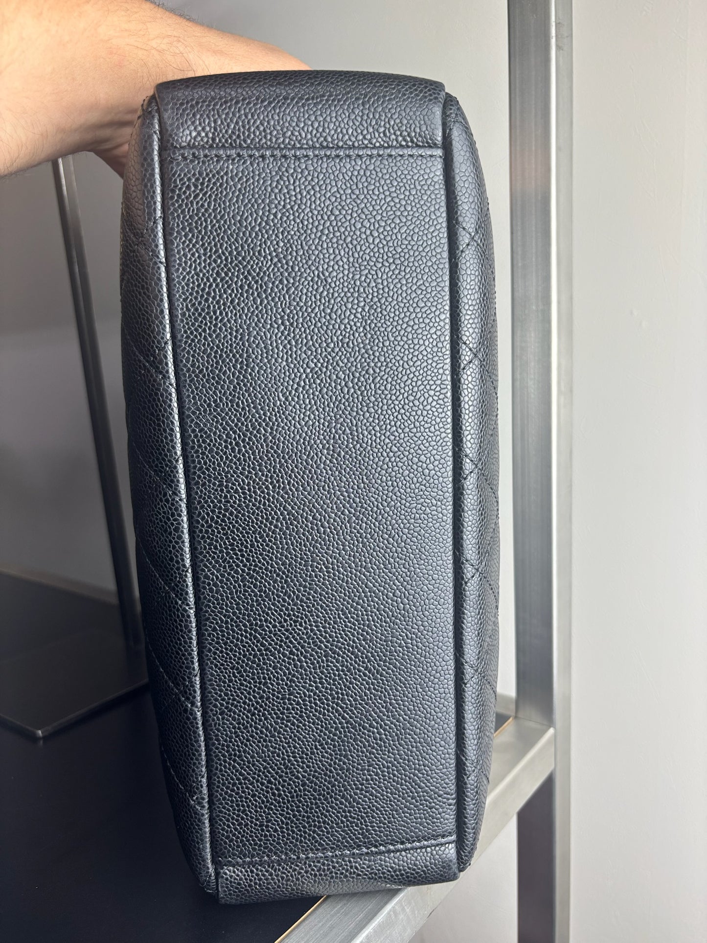 Chanel Petite Shopping Tote crafted in black caviar leather