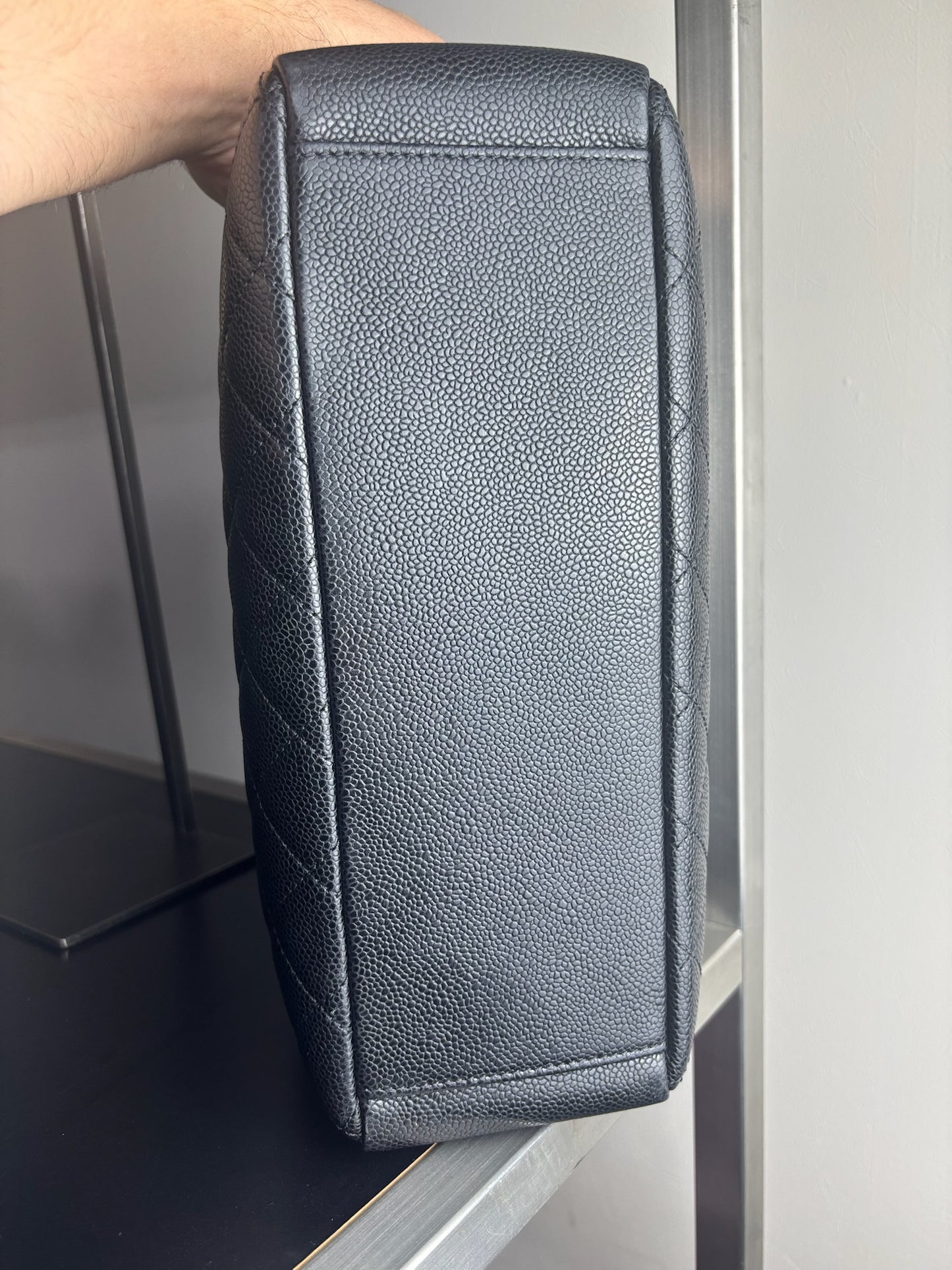 Chanel Petite Shopping Tote crafted in black caviar leather