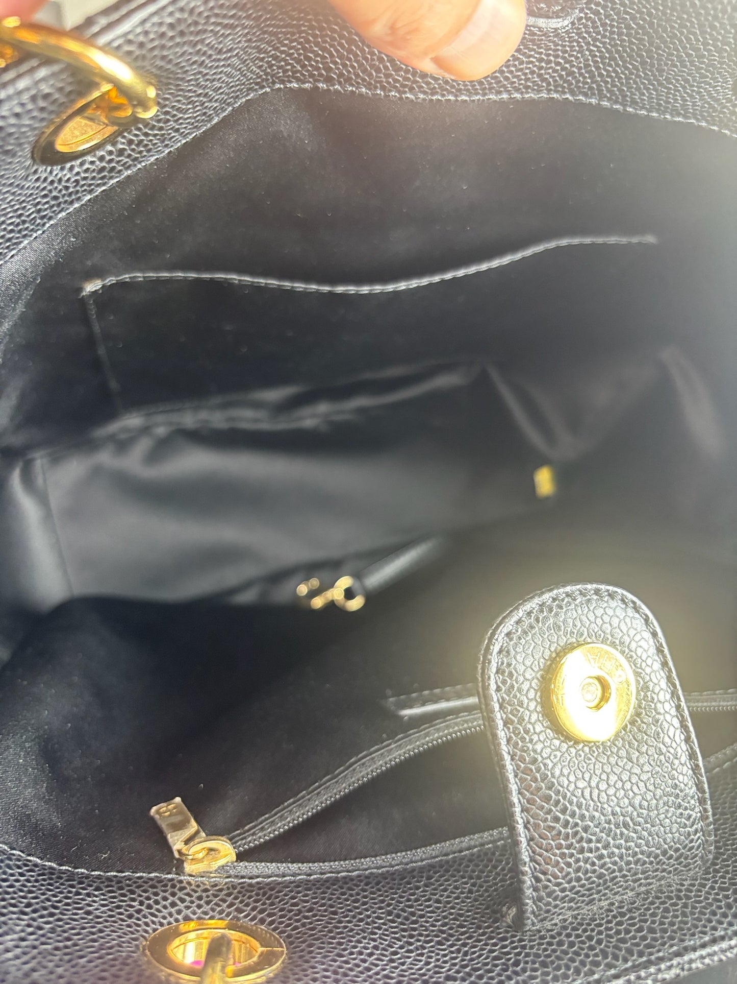 Chanel Petite Shopping Tote crafted in black caviar leather