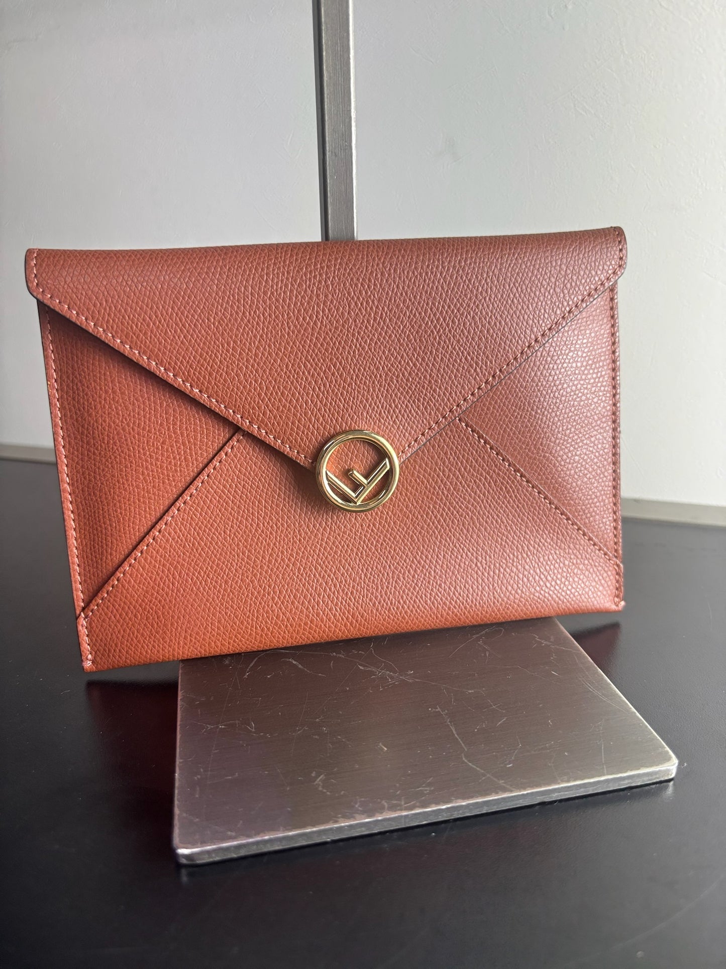 Fendi F Flat mini pouch clutch in orange pebbled leather