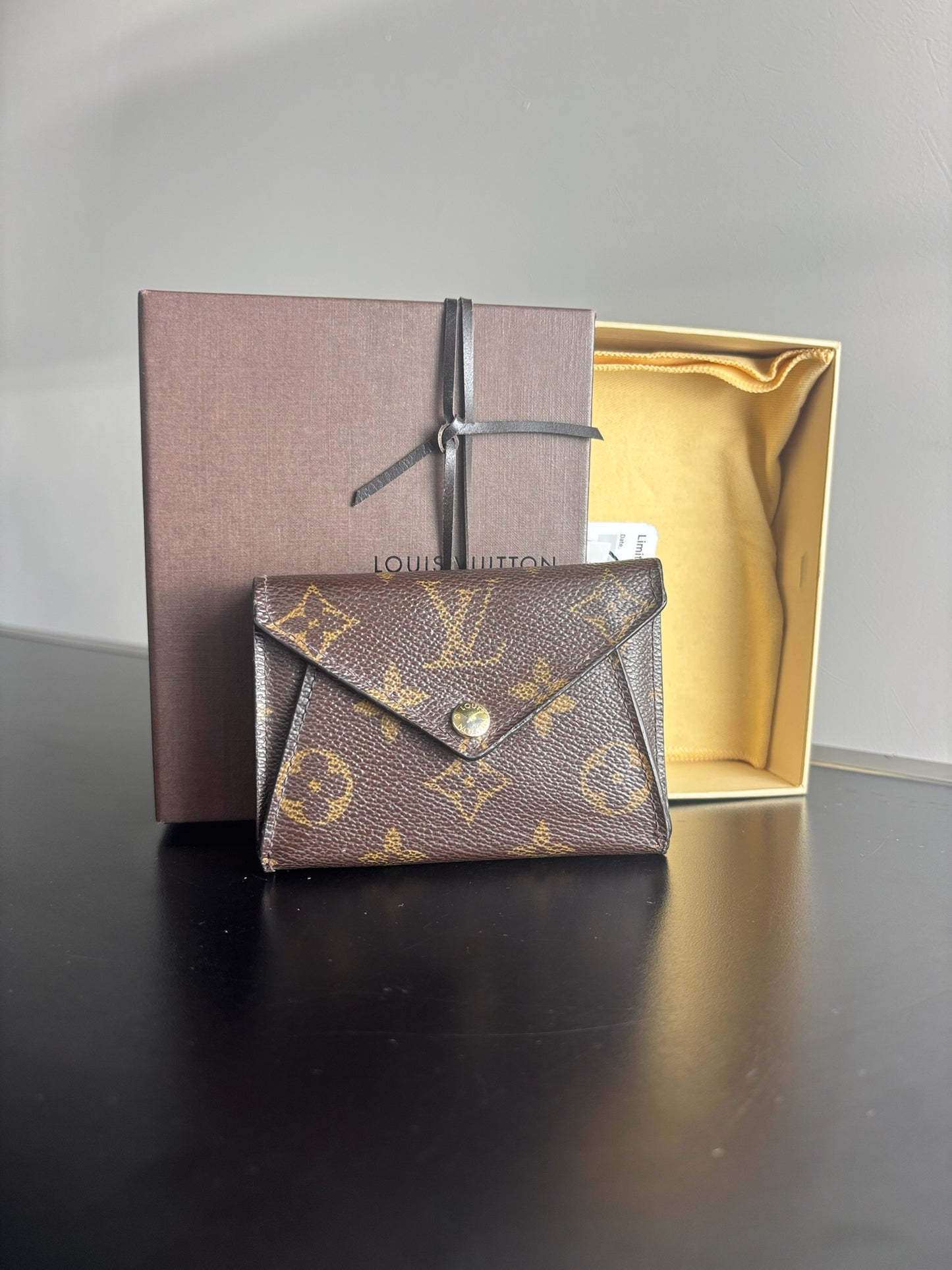 Louis Vuitton Victorine Wallet in classic monogram canvas