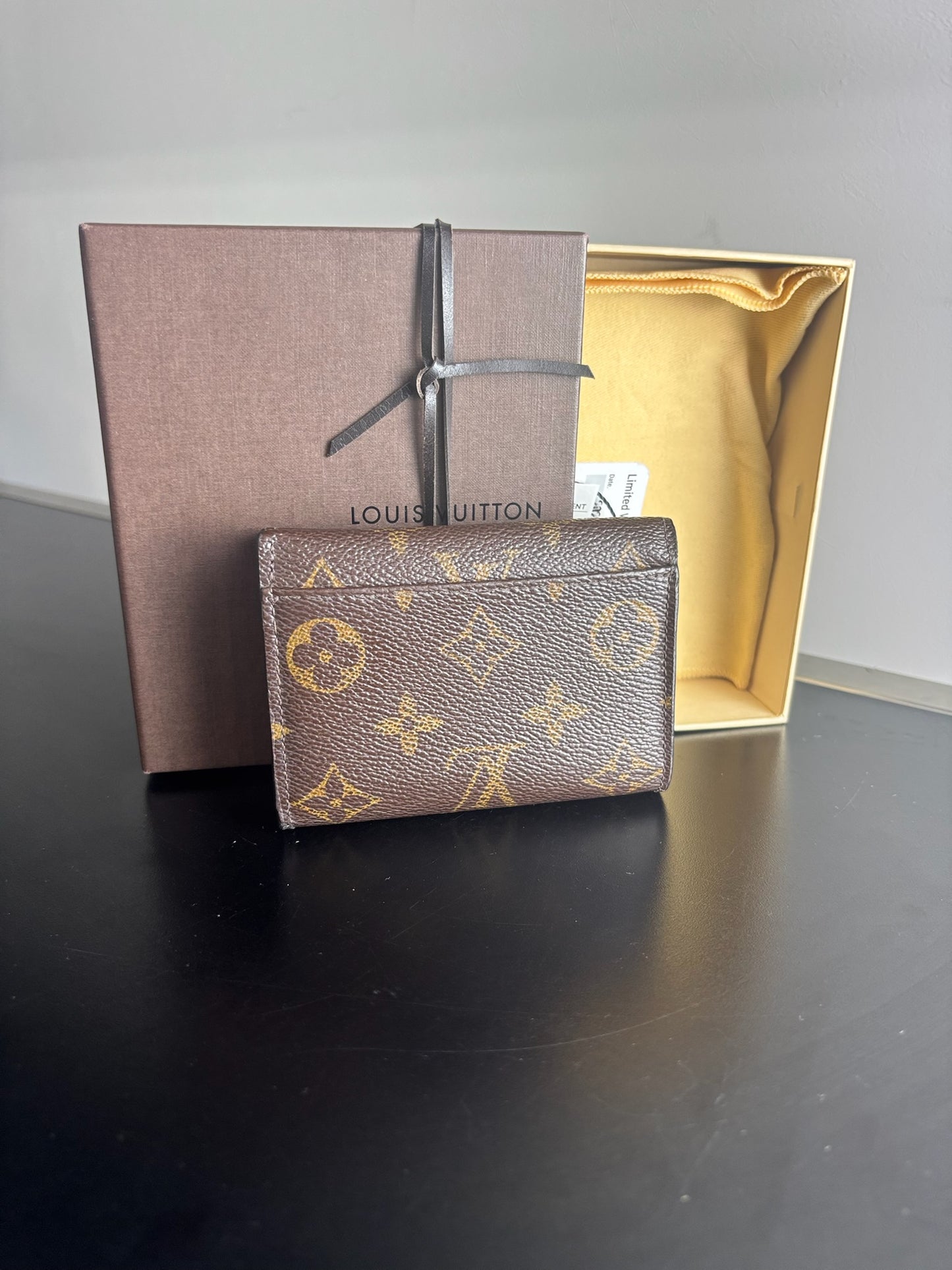 Louis Vuitton Victorine Wallet in classic monogram canvas